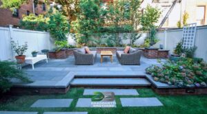 Peaceful patio area with seating and a vibrant garden